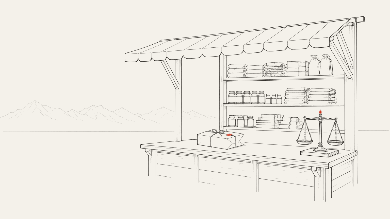 A market stall counter seen from the side, goods stacked on shelves behind it, a wrapped parcel on the counter and a set of scales at the end.